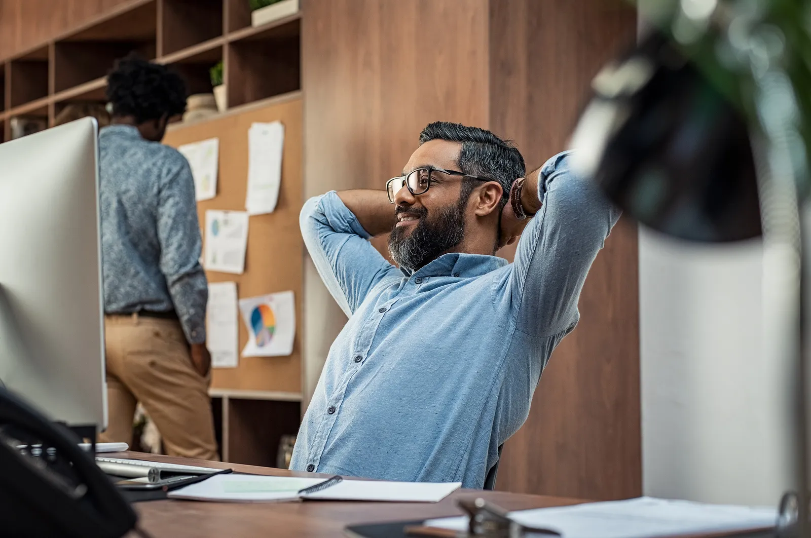 Professionals discussing work in a modern office