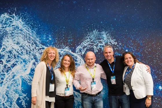 Members of the Consigas team together at an industry event.
